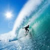 Surfer On Blue Ocean Wave