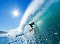 Surfer On Blue Ocean Wave