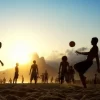 Beach Football At Sunset, Brazil